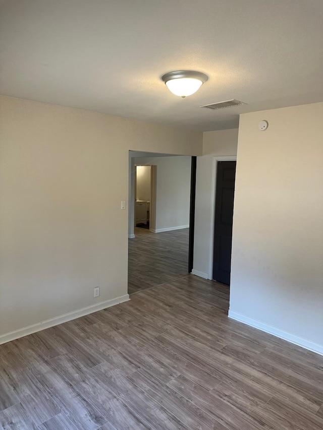 103 W Cowden Ave, Midland, TX 79701 - unfurnished room with wood finished floors and baseboards