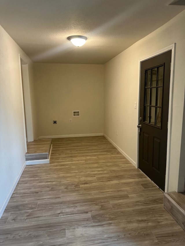 103 W Cowden Ave, Midland, TX 79701 - spare room with baseboards, wood finished floors, and a textured ceiling