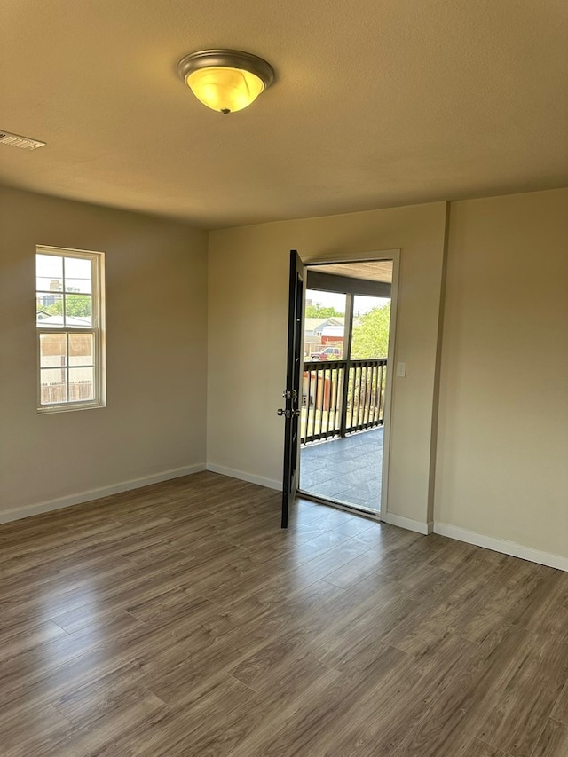103 W Cowden Ave, Midland, TX 79701 - unfurnished room featuring wood finished floors and baseboards