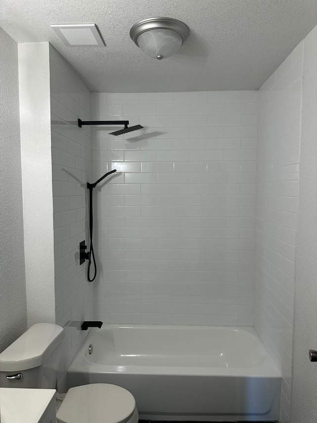 103 W Cowden Ave, Midland, TX 79701 - full bathroom featuring toilet, a textured ceiling, shower / tub combination, and vanity