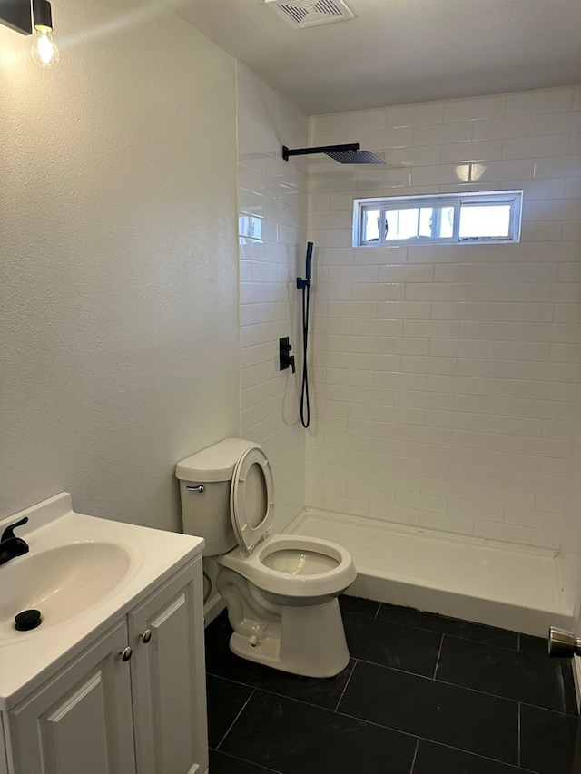 103 W Cowden Ave, Midland, TX 79701 - full bathroom with tile patterned floors, toilet, a shower stall, and vanity