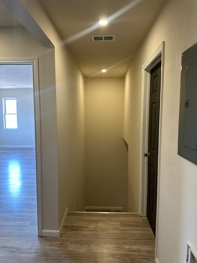 103 W Cowden Ave, Midland, TX 79701 - hallway with wood finished floors, electric panel, and baseboards