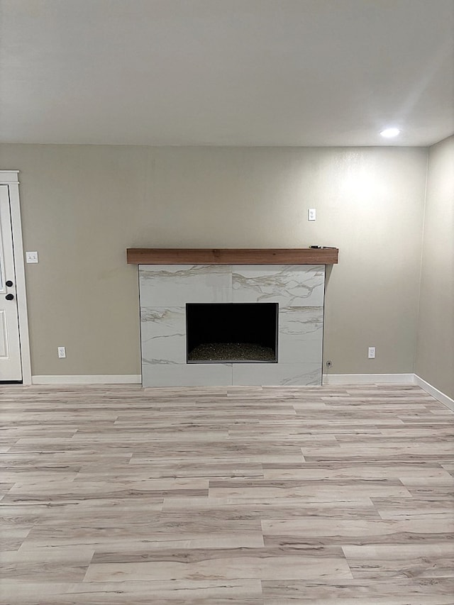 2612 Cimmaron Ave, Midland, TX 79705 - detailed view of wood finished floors, a high end fireplace, and recessed lighting
