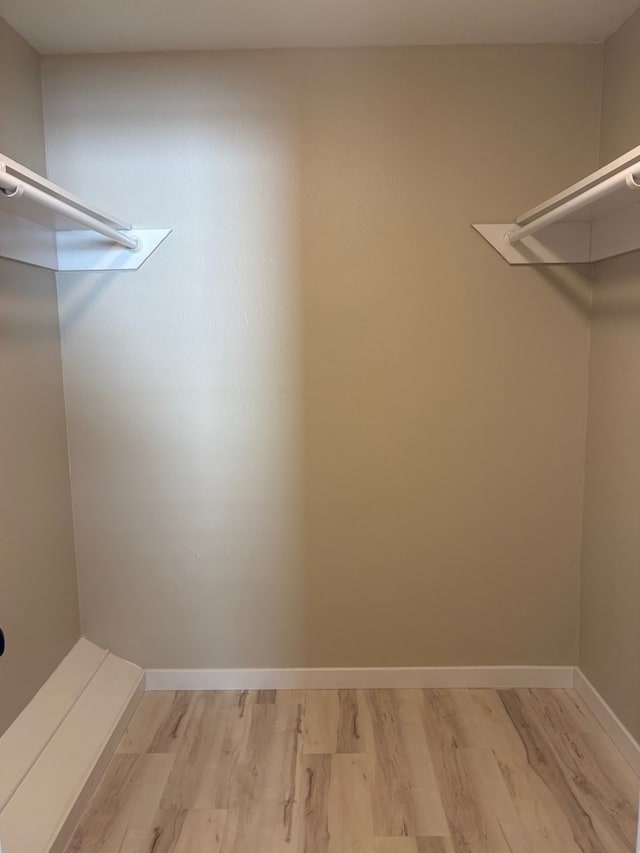 2612 Cimmaron Ave, Midland, TX 79705 - walk in closet featuring light wood-type flooring