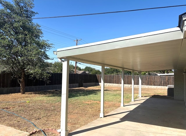 2612 Cimmaron Ave, Midland, TX 79705 - fenced backyard with a patio area and a carport