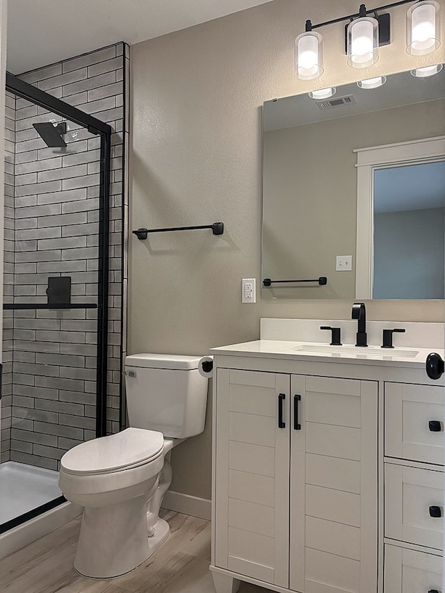 2612 Cimmaron Ave, Midland, TX 79705 - full bathroom with wood finished floors, a shower stall, and vanity