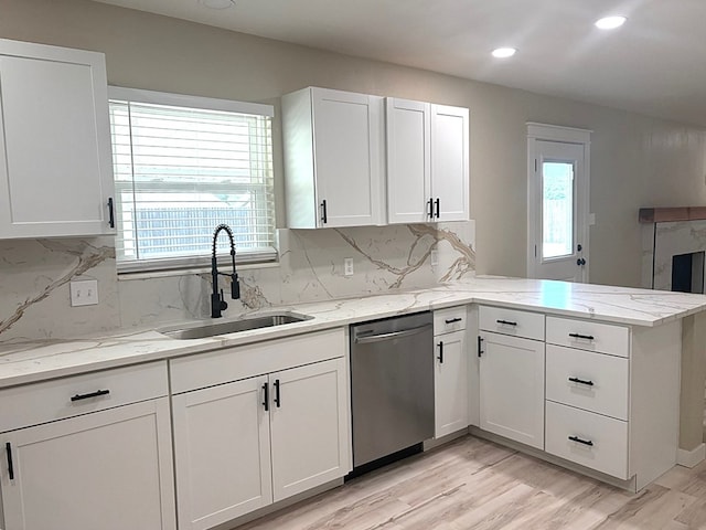 2612 Cimmaron Ave, Midland, TX 79705 - kitchen with dishwasher, healthy amount of natural light, a peninsula, white cabinetry, and recessed lighting