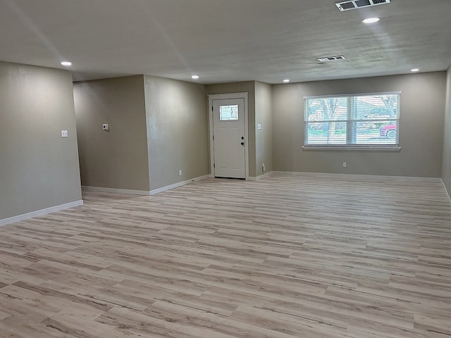 2612 Cimmaron Ave, Midland, TX 79705 - entrance foyer with light wood finished floors and recessed lighting