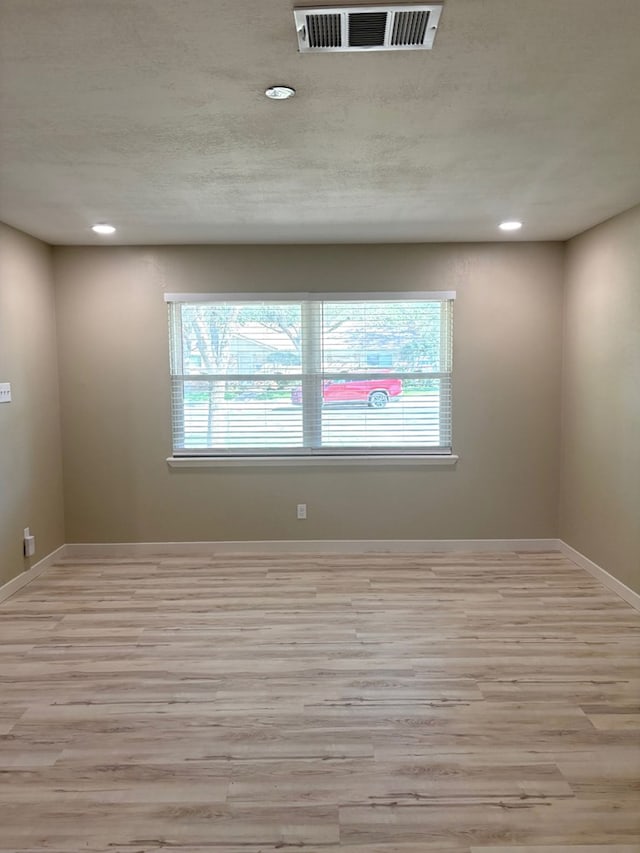 2612 Cimmaron Ave, Midland, TX 79705 - empty room with wood finished floors and recessed lighting