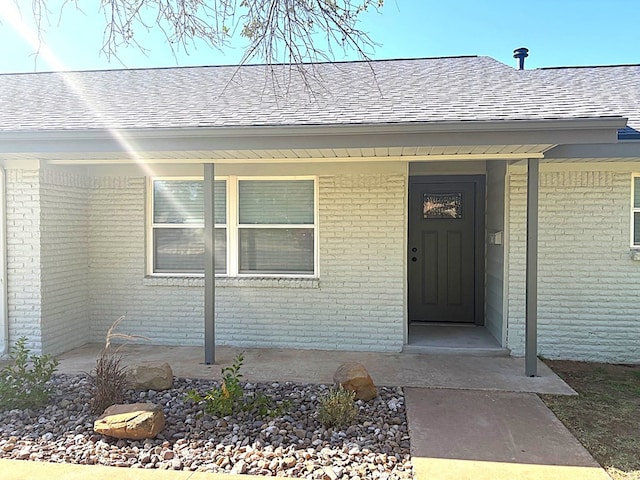 2612 Cimmaron Ave, Midland, TX 79705 - entrance to property with brick siding and a shingled roof