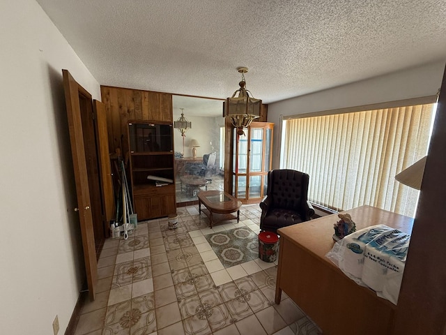 3804 Faircircle, Midland, TX 79707 - living area featuring a chandelier, a textured ceiling, and tile patterned flooring