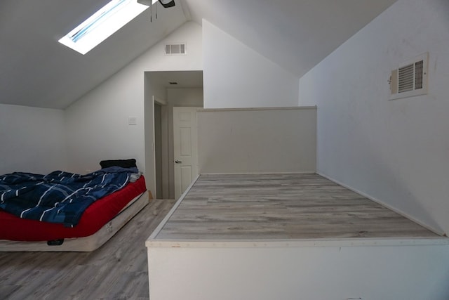 bonus room with lofted ceiling, hardwood / wood-style floors, and ceiling fan