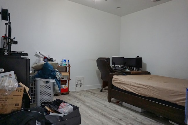 bedroom with light hardwood / wood-style flooring