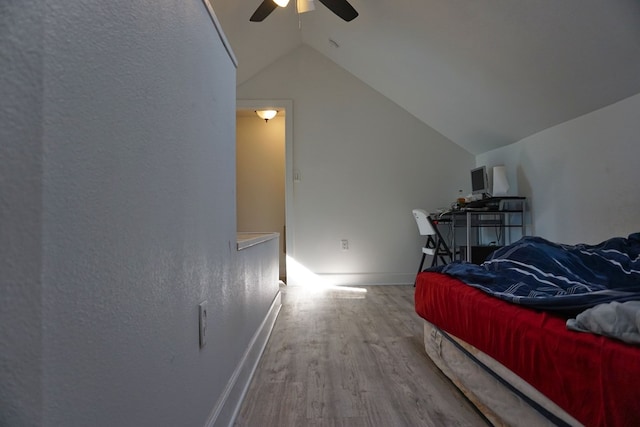 bedroom featuring vaulted ceiling, ceiling fan, and hardwood / wood-style floors