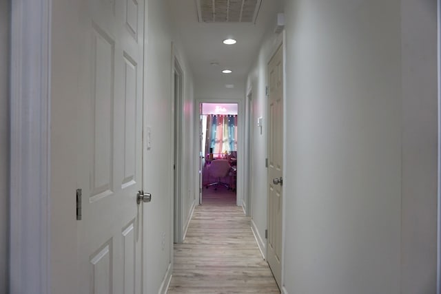 corridor featuring light hardwood / wood-style floors