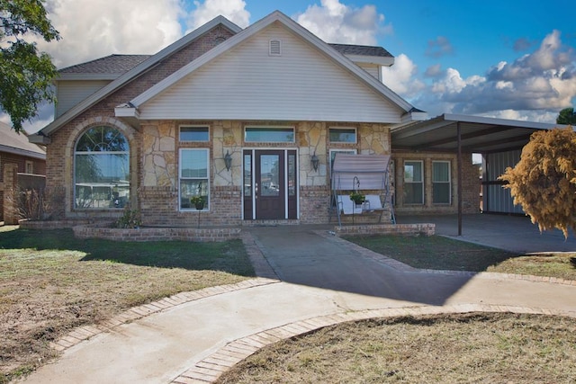 view of front facade with a carport and a front yard