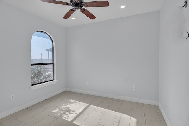 unfurnished room with ceiling fan, baseboards, and recessed lighting