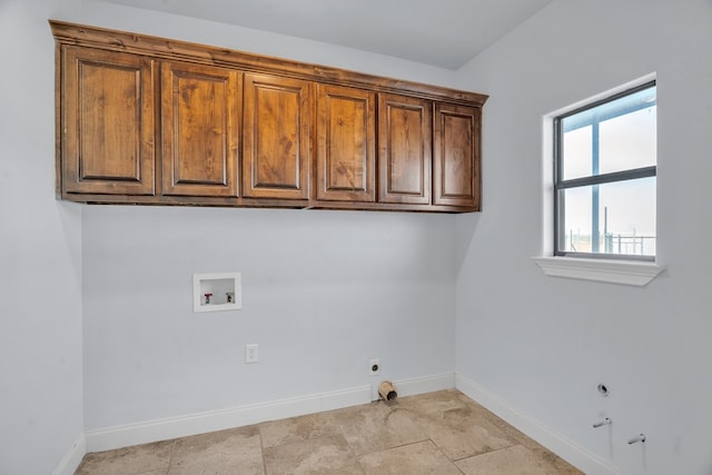 laundry area with baseboards, hookup for a gas dryer, hookup for an electric dryer, cabinet space, and hookup for a washing machine