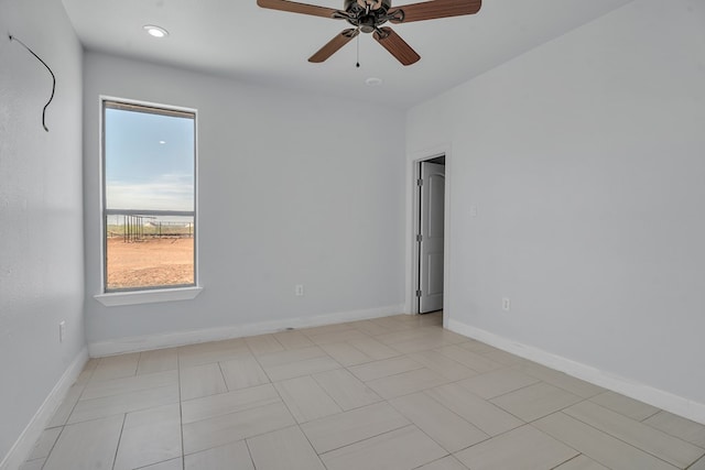 empty room with ceiling fan, baseboards, and recessed lighting
