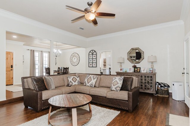 4902 Foxboro Ct, Midland, TX 79705 - living room featuring ornamental molding, dark wood-style floors, a ceiling fan, a chandelier, and baseboards