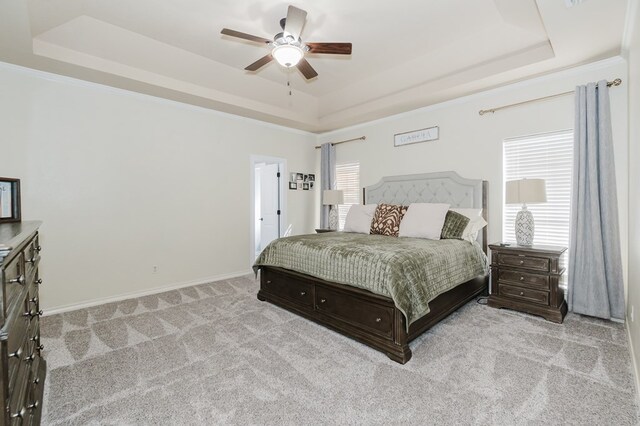 4902 Foxboro Ct, Midland, TX 79705 - bedroom featuring a tray ceiling, carpet floors, baseboards, and ceiling fan