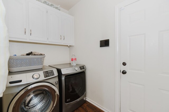 4902 Foxboro Ct, Midland, TX 79705 - laundry area featuring washer and dryer, cabinet space, dark wood-type flooring, and baseboards