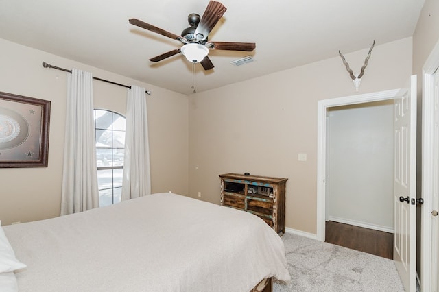 4902 Foxboro Ct, Midland, TX 79705 - bedroom with carpet floors, baseboards, and a ceiling fan