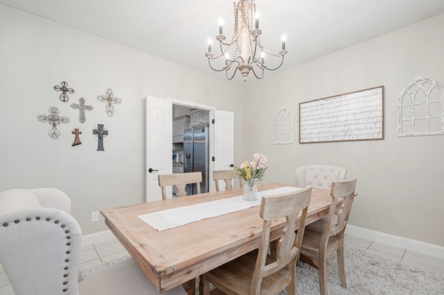 dining area with light tile patterned floors and baseboards