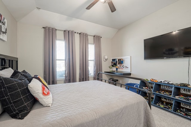 carpeted bedroom with lofted ceiling and a ceiling fan