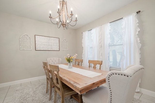 dining space with baseboards and light tile patterned flooring