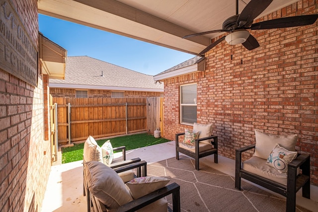 view of patio / terrace featuring outdoor lounge area, ceiling fan, and fence