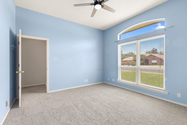 3402 Alicia Ct, Midland, TX 79707 - empty room with ceiling fan, carpet, and a textured ceiling