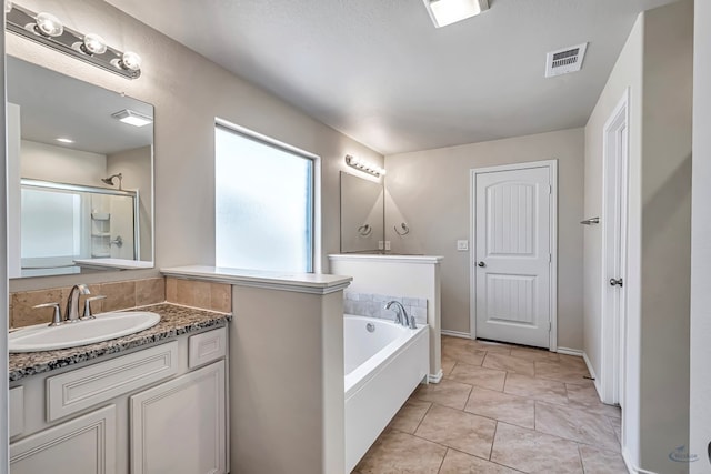 bathroom featuring tile patterned flooring, a textured ceiling, vanity, and independent shower and bath