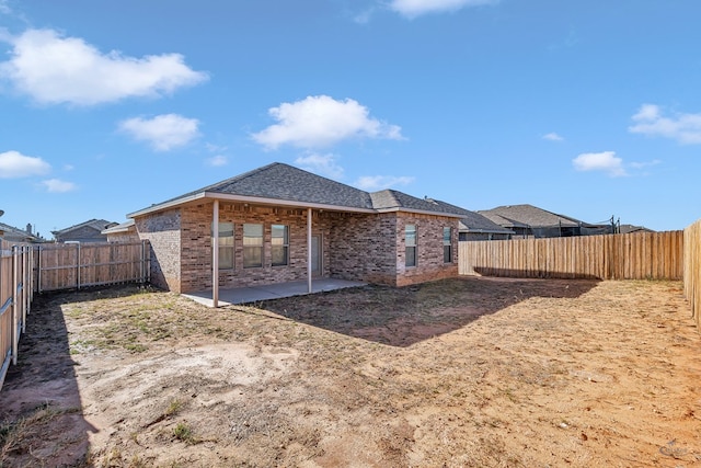 back of property with a patio area