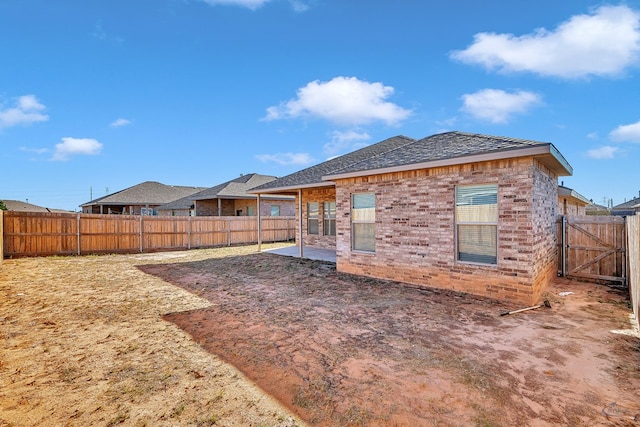 back of property with a patio