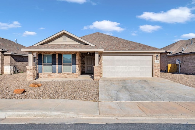 view of front of property with a porch and a garage