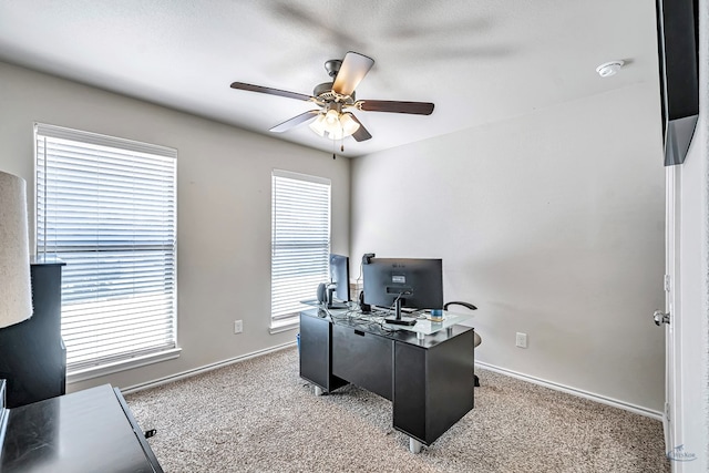 home office with ceiling fan and light colored carpet