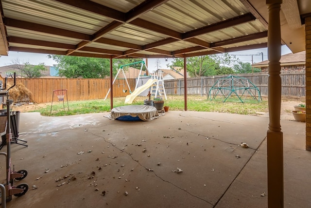 view of patio / terrace with a playground and a fenced backyard