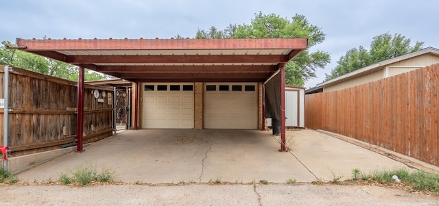 garage with a garage and fence