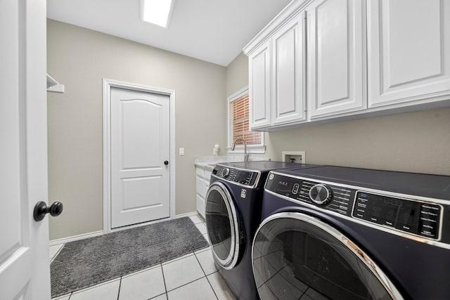 5703 Devlin Pl, Midland, TX 79707 - laundry area featuring independent washer and dryer, cabinet space, and light tile patterned floors