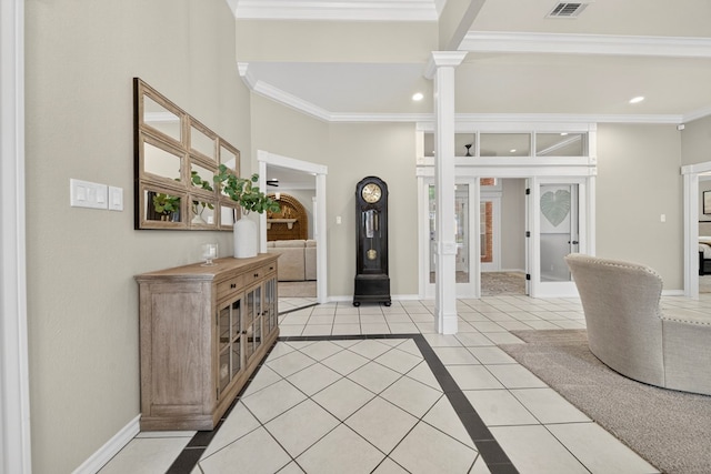 5703 Devlin Pl, Midland, TX 79707 - foyer entrance with decorative columns, light tile patterned floors, ornamental molding, and recessed lighting