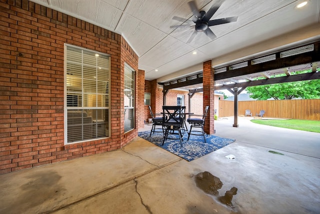 5703 Devlin Pl, Midland, TX 79707 - fenced backyard featuring ceiling fan, outdoor dining space, and a patio