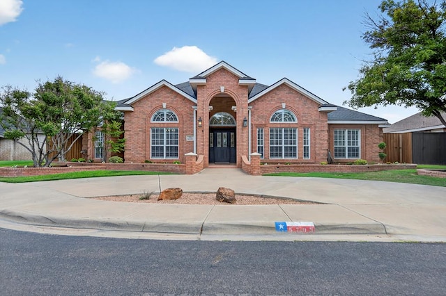 5703 Devlin Pl, Midland, TX 79707 - traditional-style house with brick siding and curved driveway