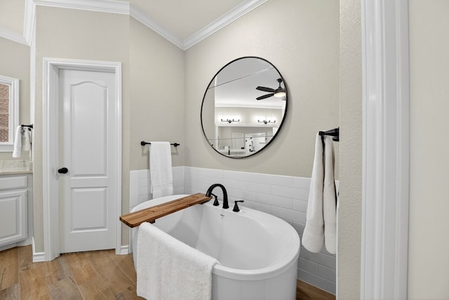 5703 Devlin Pl, Midland, TX 79707 - bathroom featuring crown molding, a freestanding tub, and wood finished floors