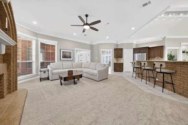 5703 Devlin Pl, Midland, TX 79707 - living room with a ceiling fan, light colored carpet, recessed lighting, crown molding, and light tile patterned flooring