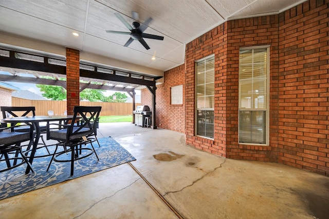 5703 Devlin Pl, Midland, TX 79707 - fenced backyard featuring outdoor dining space, ceiling fan, a patio, and a grill
