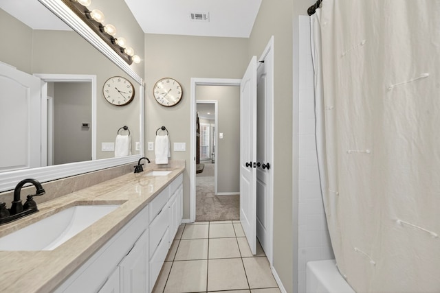 5703 Devlin Pl, Midland, TX 79707 - full bathroom with double vanity, tile patterned flooring, and shower / bath combo with shower curtain