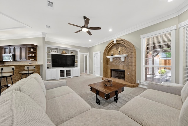 5703 Devlin Pl, Midland, TX 79707 - living area featuring ceiling fan, light carpet, crown molding, a brick fireplace, and recessed lighting