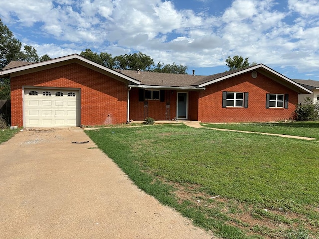 single story home featuring a garage and a front lawn