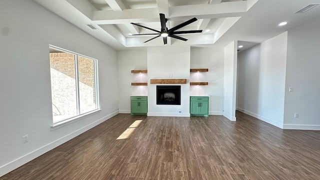 unfurnished living room featuring visible vents, baseboards, ceiling fan, and dark wood-style flooring